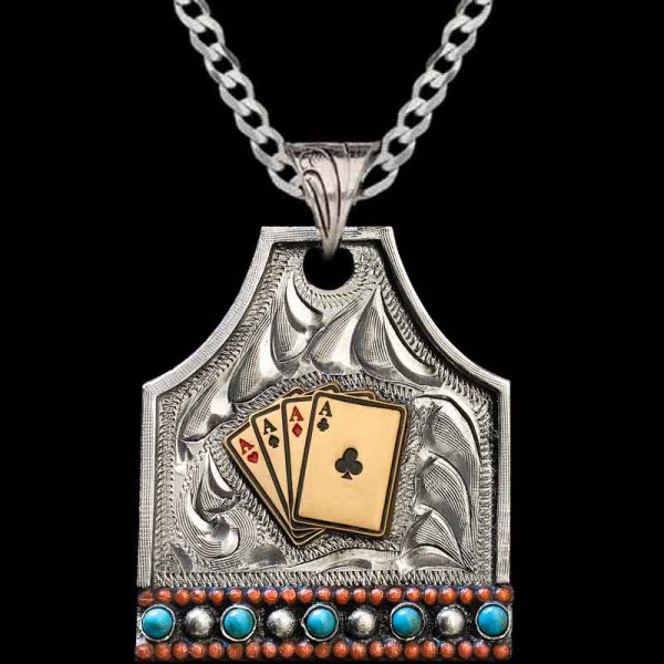 "Our BlackJack Custom Cow Tag is the perfect custom pendant to add to your collection of Western Accessories. It is crafted on a hand-engraved, German Silver base. This stunning pendant is detailed with a straight edge, Turquoise and German Silver st